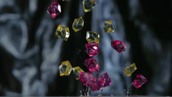 Colored cubes falling and bouncing on puddle, Slow Motion alt