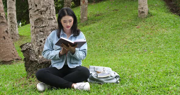 Asian Student Reading Book