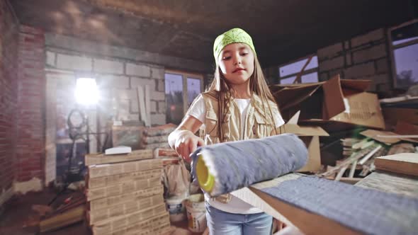 Teenage Girl Coloring Wood Plank with Roller
