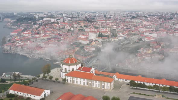 Aerial Footage of Cityscape During Foggy Morning