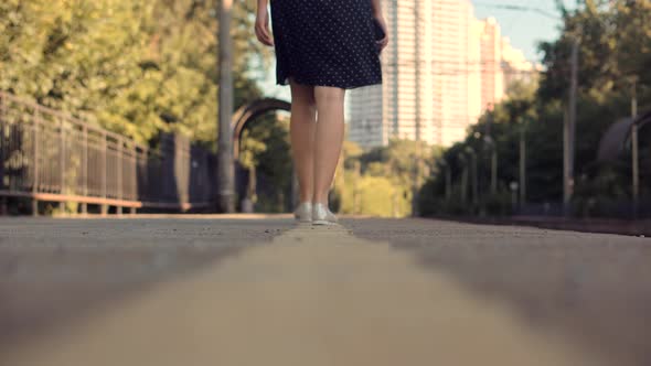 Woman In Dot Dress Walking On Railroad Station Platform. Girl Waiting Train On Public Transport.