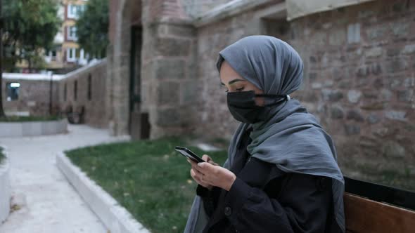 Masked Muslim Woman Muslim Woman Spend Time Social Media with Her Phone