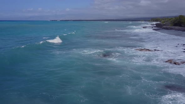 Flying Over The Rugged Coastline Of Hawaii