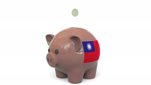 Putting Money Into Piggy Bank with Flag of Taiwan