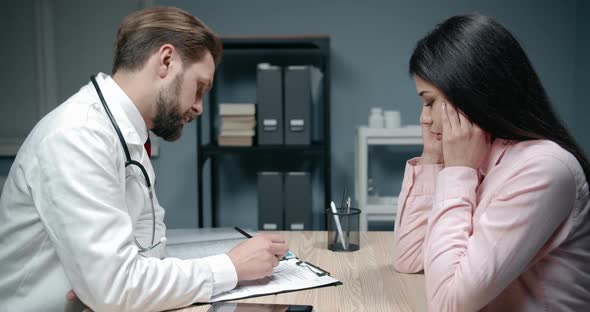 Doctor Examining Female Patient