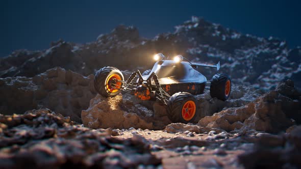 Remote-controlled car standing on rocks during the night. Camera pitch. 4KHD