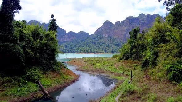 Cinematic Aerial Shot Flying Through Cheow Lan Lake Khao Sok Thailand