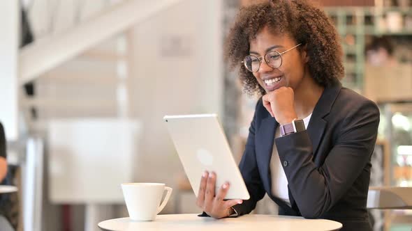 Cheerful African Businesswoman Doing Video Call on Tablet