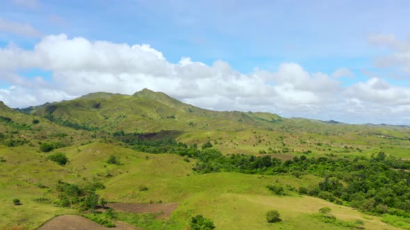 Green Hills and Blue Sky with Clouds