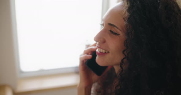 Close up of a woman talking on the phone