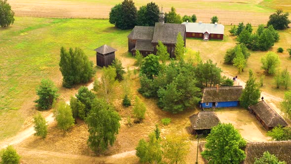 Maurzyce wooden architecture heritage park, antique building in open air museum. Aerial Lowicz, Poln