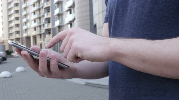 Young Man Using Smartphone