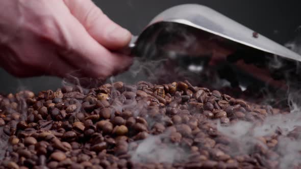 Man Hand Scooping Coffee Grains Using Ladle Close Up