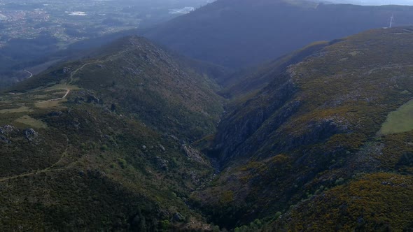 Aerial Flying Over Valley View In Foothills Of Miradoiro da Curota. Dolly Back Establishing Shot