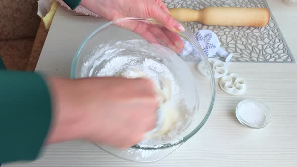 A Woman Is Stirring Powdered Sugar With The Addition Of Honey And Gelatin. Makes Pastry Mastic.