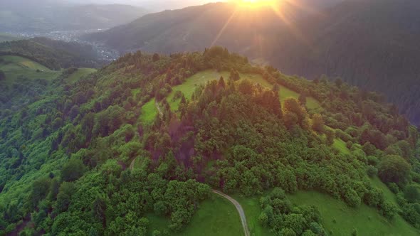 Nature Landscape of Flying Above Summer Mountains During Sunset, Hiking Route, Sun Hiding Behing