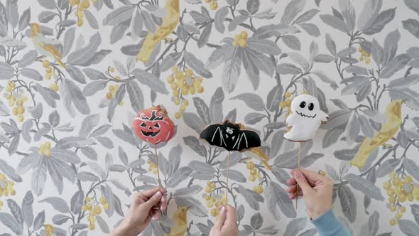 Cookies in the Style of Halloween on Sticks on a Colored Background. Fun Games in the Holiday