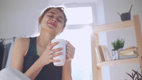 Cute Caucasian Girl Drinking Coffee From Cup in Slowmotion