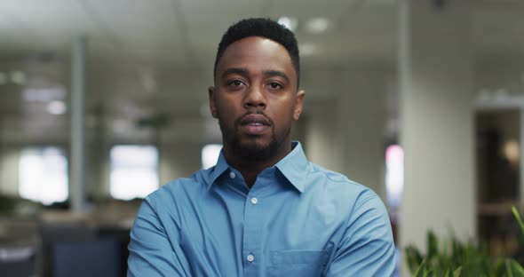 Video of serious african american man looking at camera in office