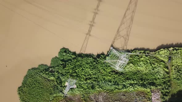 Fly over shadow of electric tower.