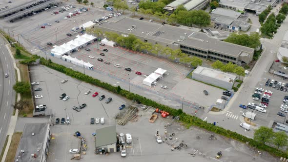 Covid-19 Vaccine Drive-through Site And Testing Center In An Open Area. aerial pullback