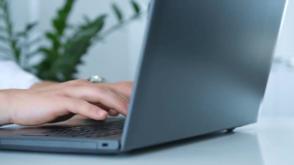 Businessman Hands Pressing Keys Of Laptop