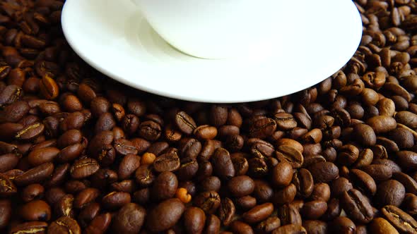 Cup with coffee on the background of coffee beans.