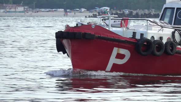 Close up of Pilot boat in the harbor. Going to meet a cargo ship. Slow motion