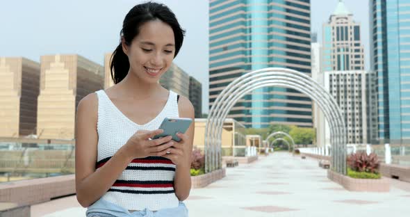 Woman using cellphone at outdoor 