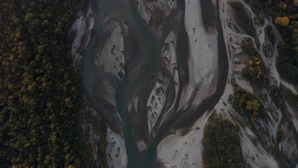 Aerial view Laba river flood forest at dawn, autumn, natural water earth patterns, Caucasus Russia