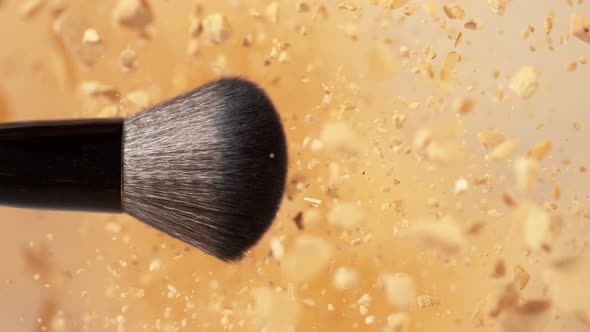 Super Slow Motion Shot of Makeup Brush and Brown Powder Explosion at 1000 Fps