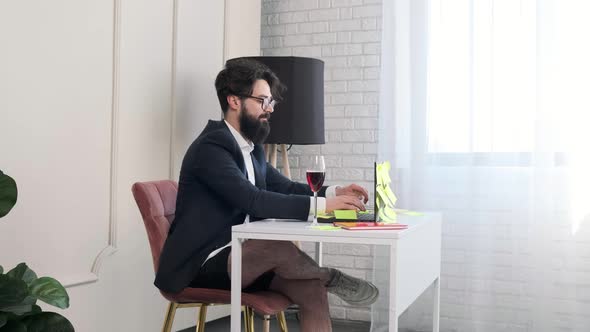 Bearded Man with No Pants Close the Computer and Enjoy a Glass of Wine