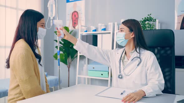 Asian woman patient visit and consult health problem with young doctor.