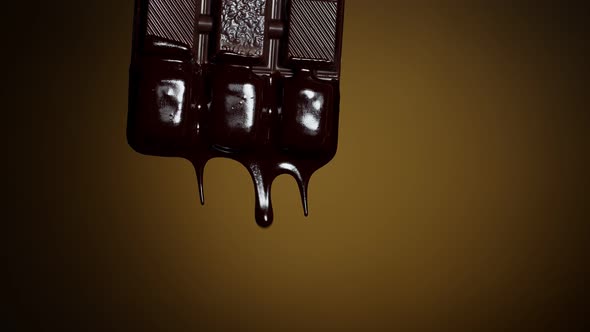 Chocolate Bar with Melted Chocolate Syrup Dripping Flowing Over Dark Brown Background Confectionery