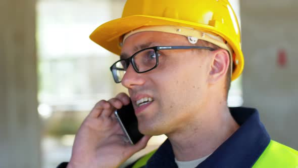 Male Builder Calling on Smartphone at Office