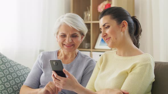 Daughter and Old Mother Having Video Call on Phone