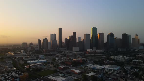 Flying toward Houston skyline at dusk