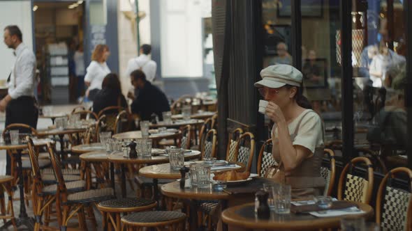 Young girl drinking coffee in the morning