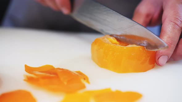 cutting persimmons with a table knife