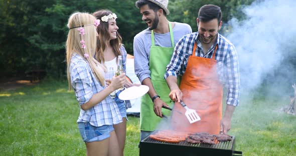 Friends Spending Time in Nature and Having Barbecue