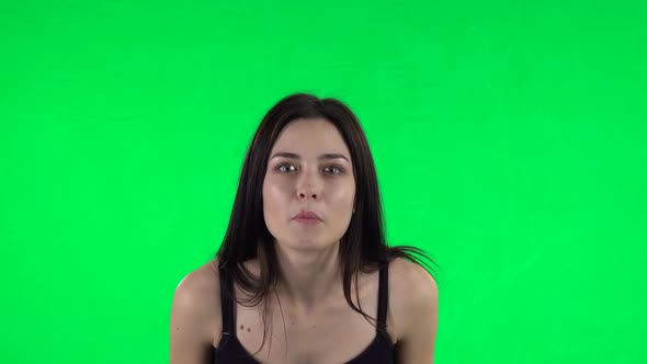 Young Surprised Girl with Shocked Wow Face Expression. Green Screen
