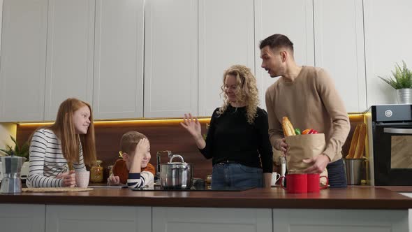Positive Deaf Family with Kids Meeting in Kitchen