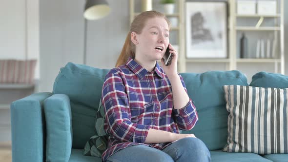 Young Woman Speaking on Phone