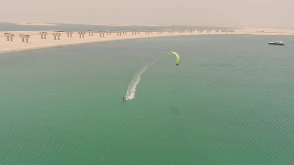 Aerial view of people practicing windsurfing at Jumeirah beach, U.A.E.