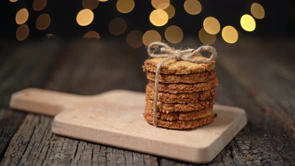 A Stack of Organic Oatmeal Cookies for Christmas with Glowing Bokeh Lights
