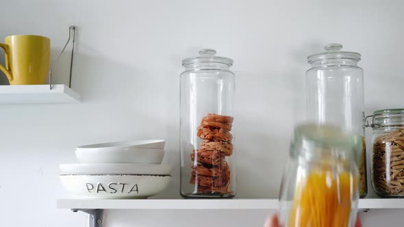 Various Sorts of Pasta in Glass Jars on a Shelf