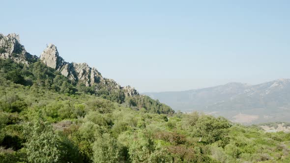 Drone slowly flying into dangerous mountains