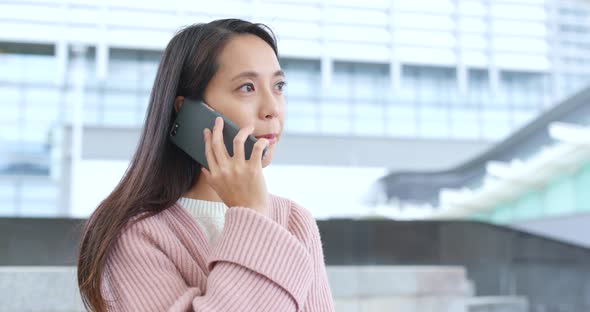 Woman talk to cellphone at outdoor