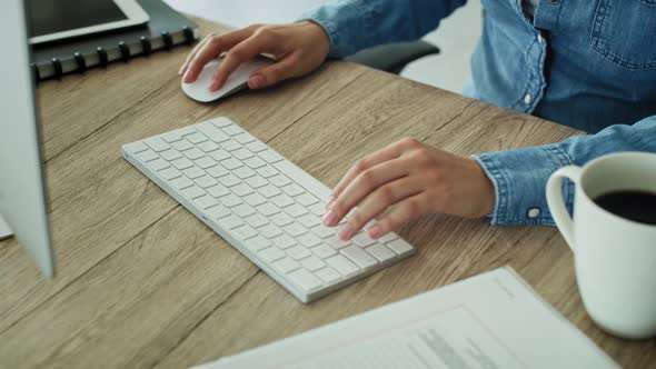 Close up tracking video hands typing on the keyboard