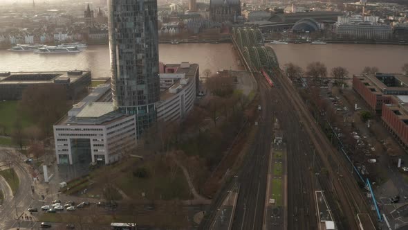 Aerial Footage of Trains Driving at Steel Railway Bridge Over Rhine River at Golden Hour